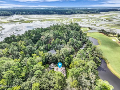 Nestled on a private one-acre homesite, this 3-bedroom, 2.5-bath on Callawassie Island Club in South Carolina - for sale on GolfHomes.com, golf home, golf lot