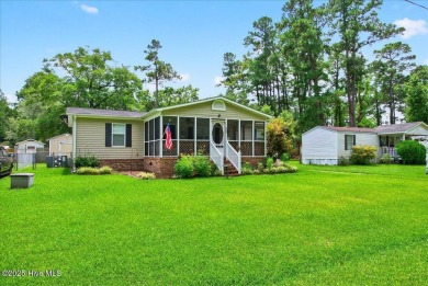 This sweet coastal cottage is move in ready. Sit on the screened on Sea Trail Golf Resort in North Carolina - for sale on GolfHomes.com, golf home, golf lot