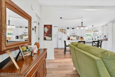 This sweet coastal cottage is move in ready. Sit on the screened on Sea Trail Golf Resort in North Carolina - for sale on GolfHomes.com, golf home, golf lot