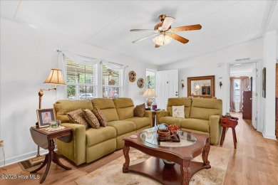 This sweet coastal cottage is move in ready. Sit on the screened on Sea Trail Golf Resort in North Carolina - for sale on GolfHomes.com, golf home, golf lot