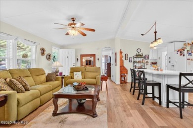 This sweet coastal cottage is move in ready. Sit on the screened on Sea Trail Golf Resort in North Carolina - for sale on GolfHomes.com, golf home, golf lot