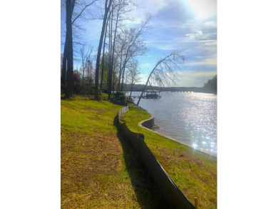 Live the lake life in South Carolina! This gorgeous lake front for sale on GolfHomes.com