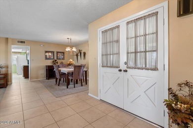 Beautifully situated on the 13th green of the scenic Ahwatukee on Ahwatukee Country Club in Arizona - for sale on GolfHomes.com, golf home, golf lot