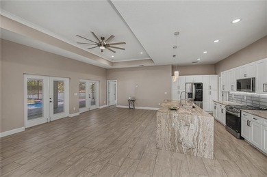 Welcome to *The Crown Jewel of Rotonda Heights* - where elevated on Rotonda Golf and Country Club The Palms Course in Florida - for sale on GolfHomes.com, golf home, golf lot