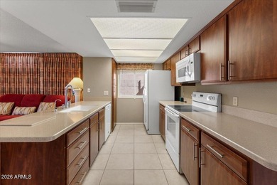 Beautifully situated on the 13th green of the scenic Ahwatukee on Ahwatukee Country Club in Arizona - for sale on GolfHomes.com, golf home, golf lot