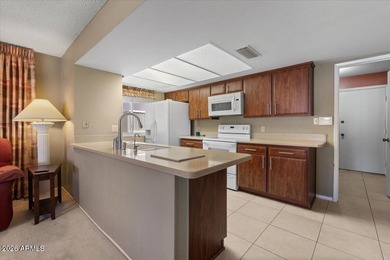 Beautifully situated on the 13th green of the scenic Ahwatukee on Ahwatukee Country Club in Arizona - for sale on GolfHomes.com, golf home, golf lot