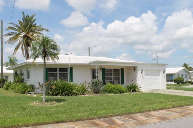 This single-family home, on a corner lot, located in Mainlands on Mainlands Golf Club in Florida - for sale on GolfHomes.com, golf home, golf lot