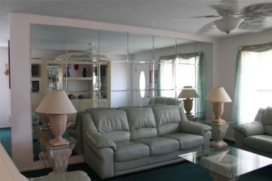This single-family home, on a corner lot, located in Mainlands on Mainlands Golf Club in Florida - for sale on GolfHomes.com, golf home, golf lot