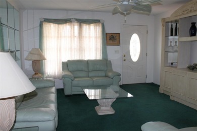 This single-family home, on a corner lot, located in Mainlands on Mainlands Golf Club in Florida - for sale on GolfHomes.com, golf home, golf lot