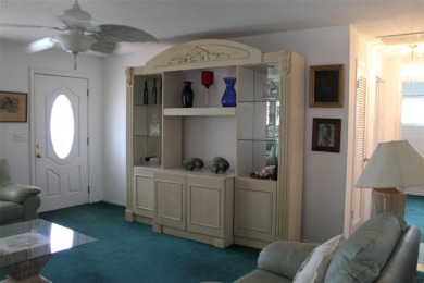 This single-family home, on a corner lot, located in Mainlands on Mainlands Golf Club in Florida - for sale on GolfHomes.com, golf home, golf lot