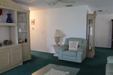 This single-family home, on a corner lot, located in Mainlands on Mainlands Golf Club in Florida - for sale on GolfHomes.com, golf home, golf lot