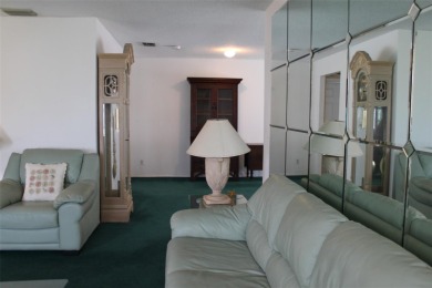 This single-family home, on a corner lot, located in Mainlands on Mainlands Golf Club in Florida - for sale on GolfHomes.com, golf home, golf lot