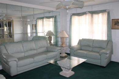 This single-family home, on a corner lot, located in Mainlands on Mainlands Golf Club in Florida - for sale on GolfHomes.com, golf home, golf lot
