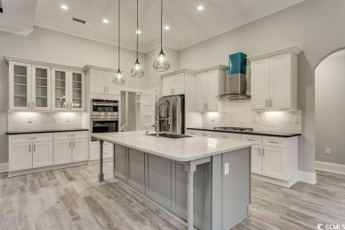 This brand-new custom home boasts 5 spacious bedrooms and 4 on Wild Wing Plantation in South Carolina - for sale on GolfHomes.com, golf home, golf lot