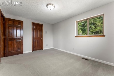 Nestled on a serene cul-de-sac and backing to open space, this on Woodmoor Pines Country Club in Colorado - for sale on GolfHomes.com, golf home, golf lot