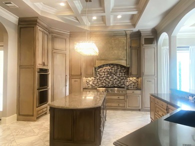 Experience refined living in this exceptional custom home on Pelican Point Golf Club in Louisiana - for sale on GolfHomes.com, golf home, golf lot