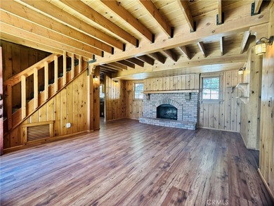 Nestled beneath towering pine trees, this charming 3-bedroom on Lake Arrowhead Country Club in California - for sale on GolfHomes.com, golf home, golf lot