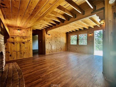 Nestled beneath towering pine trees, this charming 3-bedroom on Lake Arrowhead Country Club in California - for sale on GolfHomes.com, golf home, golf lot