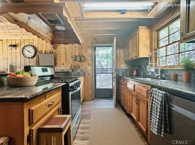 Nestled beneath towering pine trees, this charming 3-bedroom on Lake Arrowhead Country Club in California - for sale on GolfHomes.com, golf home, golf lot