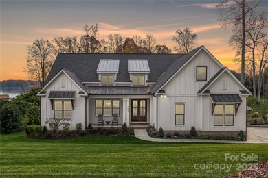 Discover refined lakeside living in this custom home completed on Mallard Head Country Club in North Carolina - for sale on GolfHomes.com, golf home, golf lot