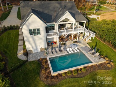 Discover refined lakeside living in this custom home completed on Mallard Head Country Club in North Carolina - for sale on GolfHomes.com, golf home, golf lot