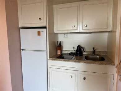 Welcome to this charming 9th-floor 1-bedroom retreat at The on Leisure Village Par 3 Golf Course in California - for sale on GolfHomes.com, golf home, golf lot