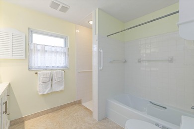 Experience quintessential Florida living in this spacious on Village Green Golf Club of Sarasota in Florida - for sale on GolfHomes.com, golf home, golf lot