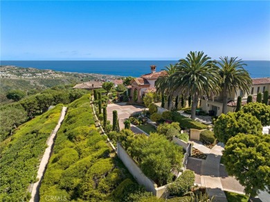 Indulge in elegant coastal living at this opulent ocean-view on Pelican Hill Golf Club in California - for sale on GolfHomes.com, golf home, golf lot