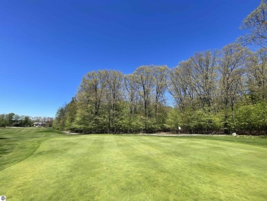 Surround yourself among nature and endless recreation on Manitou Passage Golf Club in Michigan - for sale on GolfHomes.com, golf home, golf lot