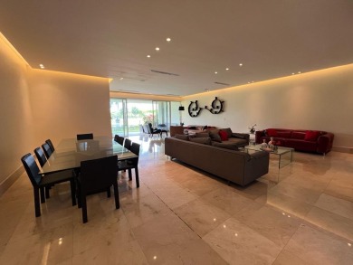 Spacious and comfortable apartment with a grass-covered patio on  in  - for sale on GolfHomes.com, golf home, golf lot