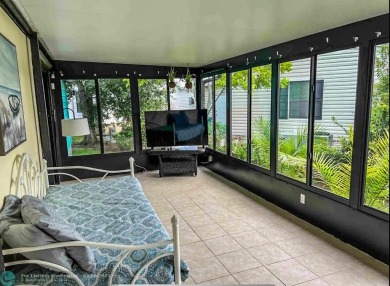 Beautiful and Tropically inspired home in the beautiful Barefoot on Barefoot Bay Golf Course in Florida - for sale on GolfHomes.com, golf home, golf lot