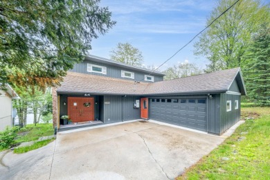 Enjoy breathtaking water views from this spacious 4-bedroom on St. Ives Golf Club in Michigan - for sale on GolfHomes.com, golf home, golf lot