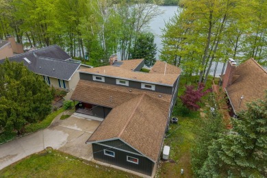 Enjoy breathtaking water views from this spacious 4-bedroom on St. Ives Golf Club in Michigan - for sale on GolfHomes.com, golf home, golf lot
