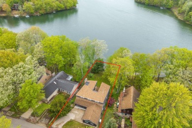 Enjoy breathtaking water views from this spacious 4-bedroom on St. Ives Golf Club in Michigan - for sale on GolfHomes.com, golf home, golf lot