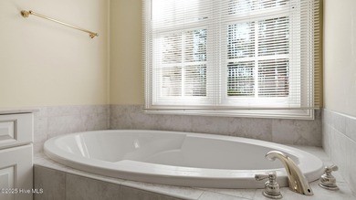 Welcome to 380 Grove Rd, a beautifully crafted Bundy Homes on Pine Needles Lodge and Golf Club in North Carolina - for sale on GolfHomes.com, golf home, golf lot