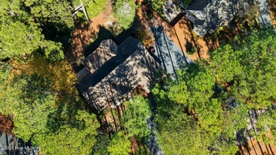 Welcome to 380 Grove Rd, a beautifully crafted Bundy Homes on Pine Needles Lodge and Golf Club in North Carolina - for sale on GolfHomes.com, golf home, golf lot