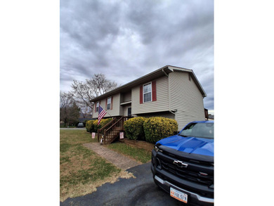 This split-foyer home sits on a desirable corner lot and on Brookside Golf Course in Virginia - for sale on GolfHomes.com, golf home, golf lot