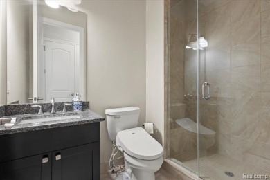Enjoy maintenance-free golf course living on the first green of on Pine Knob Golf Club - Hawk in Michigan - for sale on GolfHomes.com, golf home, golf lot