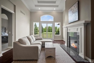 Enjoy maintenance-free golf course living on the first green of on Pine Knob Golf Club - Hawk in Michigan - for sale on GolfHomes.com, golf home, golf lot