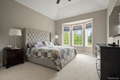 Enjoy maintenance-free golf course living on the first green of on Pine Knob Golf Club - Hawk in Michigan - for sale on GolfHomes.com, golf home, golf lot