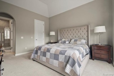 Enjoy maintenance-free golf course living on the first green of on Pine Knob Golf Club - Hawk in Michigan - for sale on GolfHomes.com, golf home, golf lot