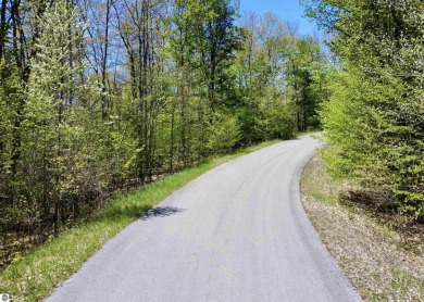 Surround yourself among nature and endless recreation on Manitou Passage Golf Club in Michigan - for sale on GolfHomes.com, golf home, golf lot