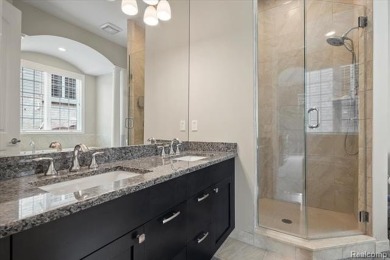 Enjoy maintenance-free golf course living on the first green of on Pine Knob Golf Club - Hawk in Michigan - for sale on GolfHomes.com, golf home, golf lot