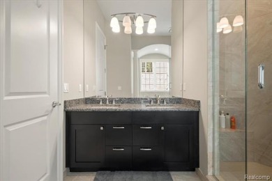 Enjoy maintenance-free golf course living on the first green of on Pine Knob Golf Club - Hawk in Michigan - for sale on GolfHomes.com, golf home, golf lot