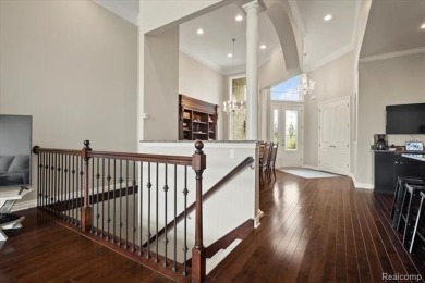 Enjoy maintenance-free golf course living on the first green of on Pine Knob Golf Club - Hawk in Michigan - for sale on GolfHomes.com, golf home, golf lot
