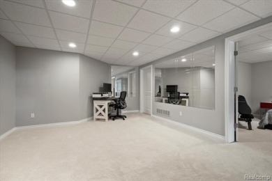 Enjoy maintenance-free golf course living on the first green of on Pine Knob Golf Club - Hawk in Michigan - for sale on GolfHomes.com, golf home, golf lot