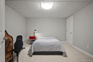 Enjoy maintenance-free golf course living on the first green of on Pine Knob Golf Club - Hawk in Michigan - for sale on GolfHomes.com, golf home, golf lot