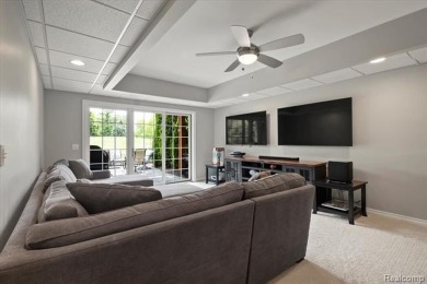 Enjoy maintenance-free golf course living on the first green of on Pine Knob Golf Club - Hawk in Michigan - for sale on GolfHomes.com, golf home, golf lot
