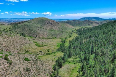 With mostly pines, aspens and rock outcroppings, this property on Fox Acres Country Club in Colorado - for sale on GolfHomes.com, golf home, golf lot