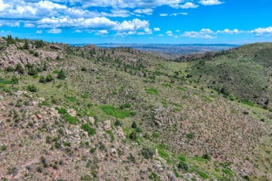 With mostly pines, aspens and rock outcroppings, this property on Fox Acres Country Club in Colorado - for sale on GolfHomes.com, golf home, golf lot